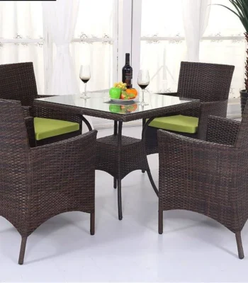 5-piece dark brown wicker patio dining set with green seat cushions, table without glass top