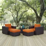 5-piece outdoor rattan sofa set in dark brown with vibrant orange cushions, including sofa, chairs, and coffee table