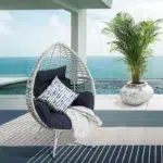 White single seater swing basket with cushioned seat, perfect for balcony or garden use.