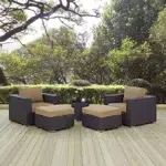 5-piece outdoor patio sofa set featuring dark brown wicker frame, beige cushions, a central coffee table, and matching ottomans