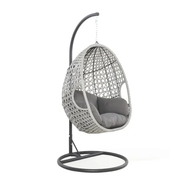 Single seater hanging swing with silver frame and grey cushioned seat placed in a garden.