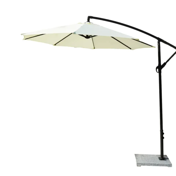 Off-white 9 ft outdoor cantilever patio umbrella with marble base and crank handle in a garden setting.