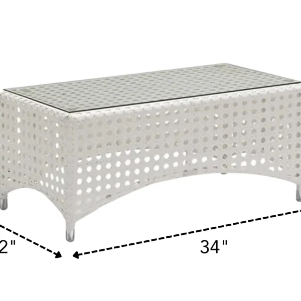 Outdoor 4-seater sofa set with white and beige cushions, placed in a garden setting for relaxation.