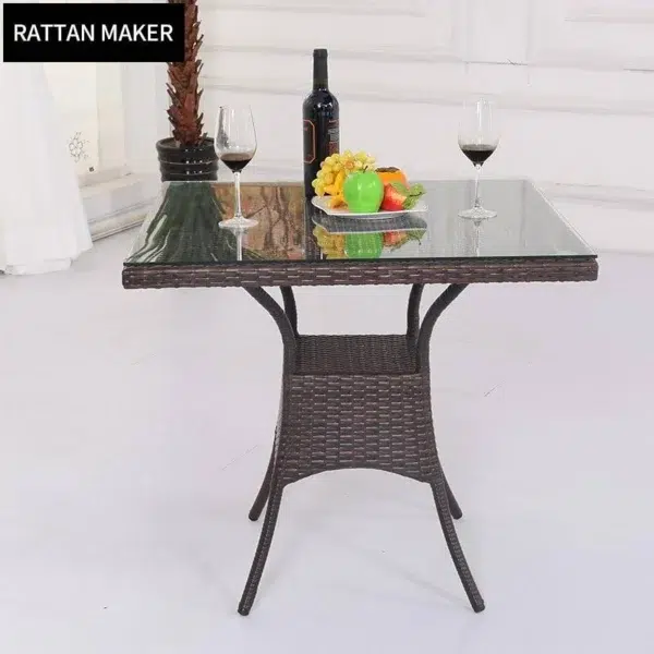 5-piece dark brown wicker patio dining set with green seat cushions, table without glass top