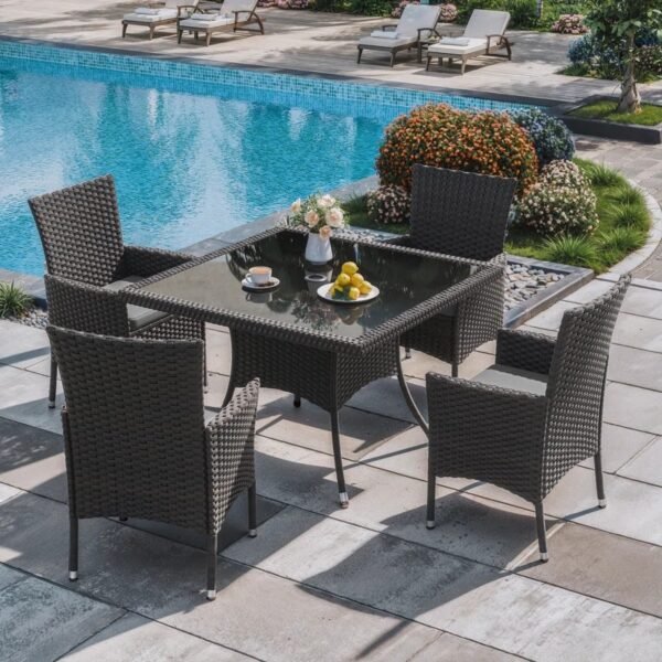 5-piece outdoor rattan dining set with grey cushions and dark brown armchairs, perfect for patio or garden