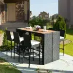 7-piece outdoor rattan bar set in black and off-white with high stools, table, and cushions, perfect for garden or patio settings.
