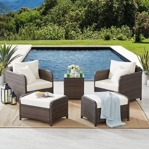 Modern outdoor patio set with stylish seating and center table, perfect for garden or balcony.