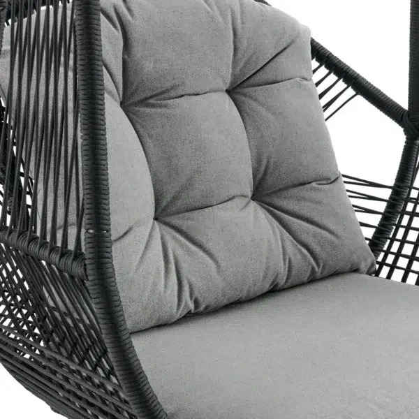 Single-seater hanging swing with a black braided rope and metal stand, placed in a garden setting.