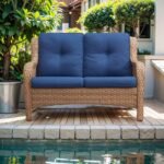 Double seater rattan wicker sofa with soft cushions for patio or garden seating