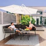 Outdoor patio rope conversation sofa set in grey and black with matching coffee table, perfect for outdoor relaxation.