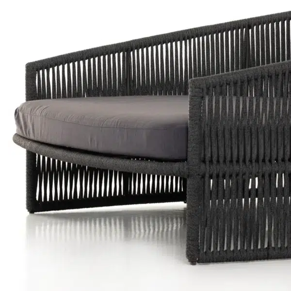 Black outdoor patio rope daybed for garden, terrace, balcony, and poolside lounging, made with rattan and durable rope.