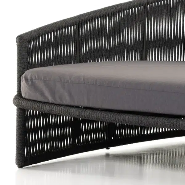 Black outdoor patio rope daybed for garden, terrace, balcony, and poolside lounging, made with rattan and durable rope.