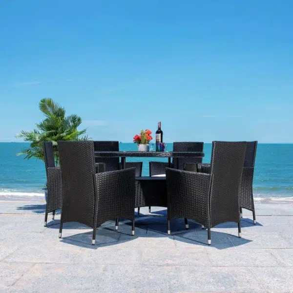 6-person round outdoor dining set with comfortable black cushions, perfect for patio, garden, or backyard.
