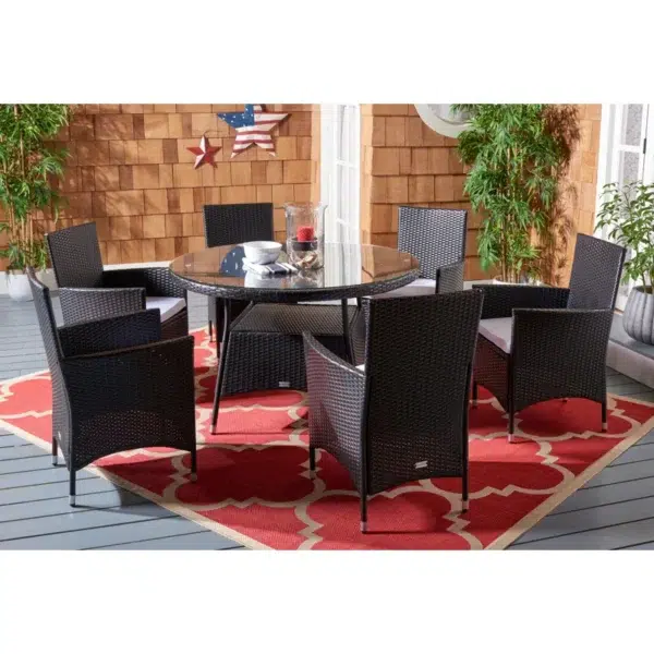 6-person round outdoor dining set with comfortable black cushions, perfect for patio, garden, or backyard.