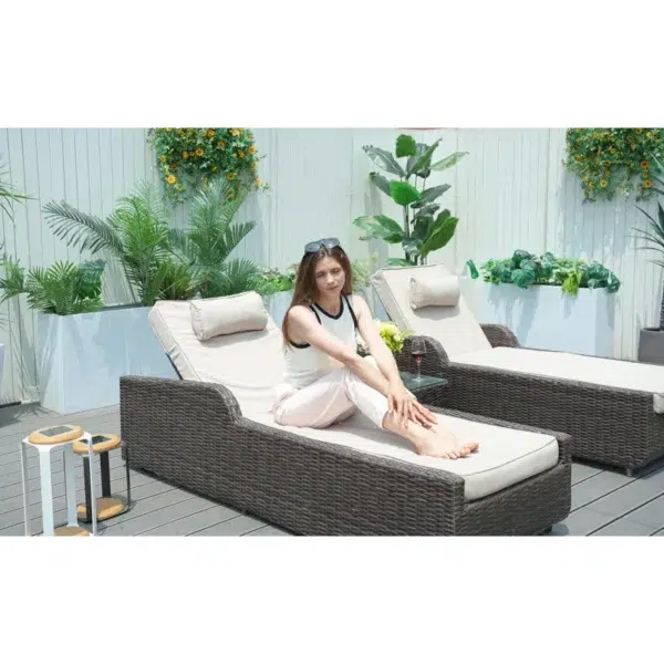 Rattan wicker long reclining outdoor chaise lounge in brown and off-white with cushions.