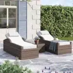 Rattan wicker long reclining outdoor chaise lounge in brown and off-white with cushions.