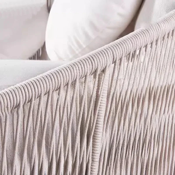 Outdoor round daybed with woven rope design in beige, perfect for relaxing in the garden or patio.