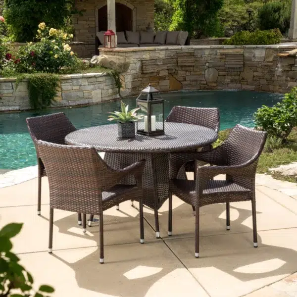 4-person round outdoor dining set with comfortable cushioned seats in garden/patio setting