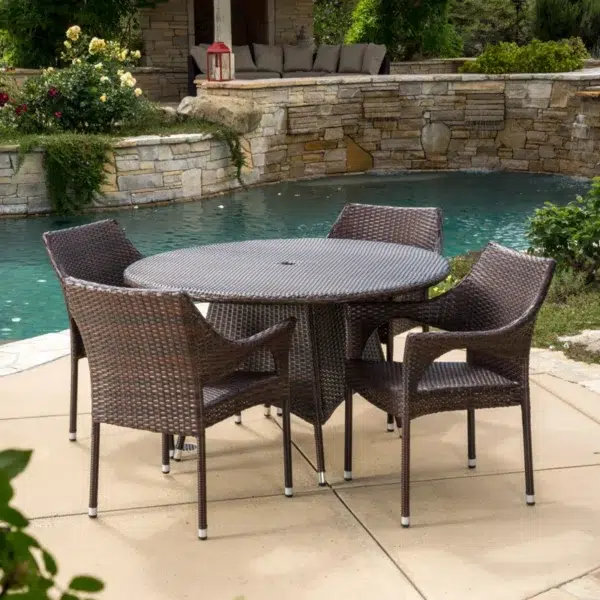 4-person round outdoor dining set with comfortable cushioned seats in garden/patio setting