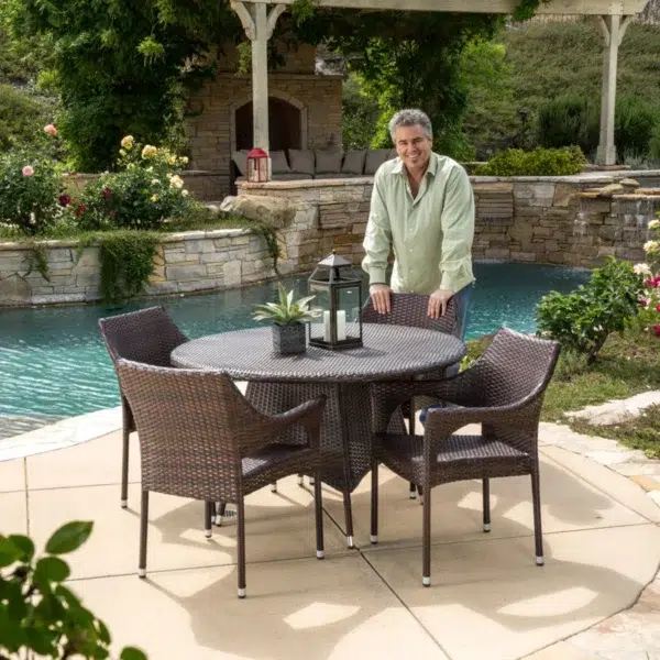 4-person round outdoor dining set with comfortable cushioned seats in garden/patio setting