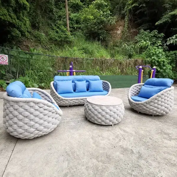 Outdoor 5-seater rope weaving sofa set in light grey and blue with cushioned seating.