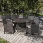 4-Person round outdoor dining set with cushioned chairs, ideal for garden, patio, or balcony