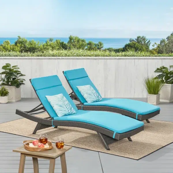 Set of 2 outdoor patio recliner lounger chairs in dark brown frame with sky blue all-weather cushions.