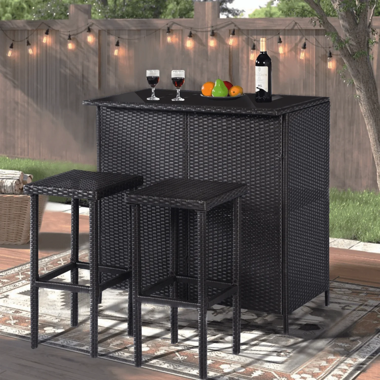 3 piece dark brown wicker patio outdoor bar set with table and two stools placed on a garden deck.