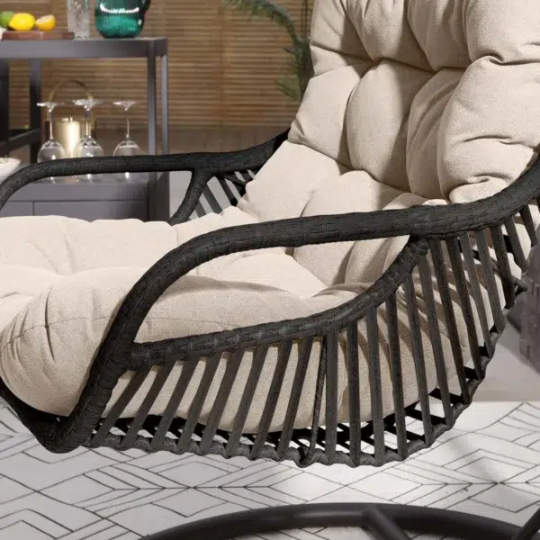 Single seater hanging swing with stand in black and beige, perfect for balcony or garden relaxation.