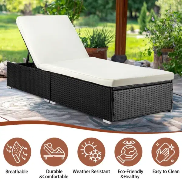 Outdoor rattan wicker sun lounger recliner chair in black and off-white, perfect for garden relaxation.