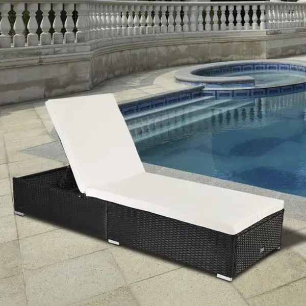 Outdoor rattan wicker sun lounger recliner chair in black and off-white, perfect for garden relaxation.
