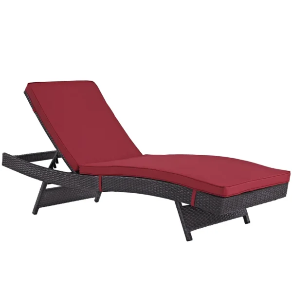 Add a pop of color and comfort to your patio with this stylish dark red wicker chaise lounge chair.
