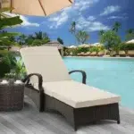 Wicker rattan outdoor patio chaise lounge chair with side table in cream color, perfect for relaxing outdoors.