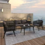 A set of 4 sofa chairs in black and dark grey upholstery, arranged in a stylish living room setup.