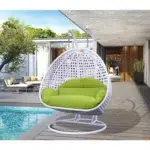 Light green and white swing chair with a sturdy stand and cushioned seat, perfect for indoor and outdoor relaxation.