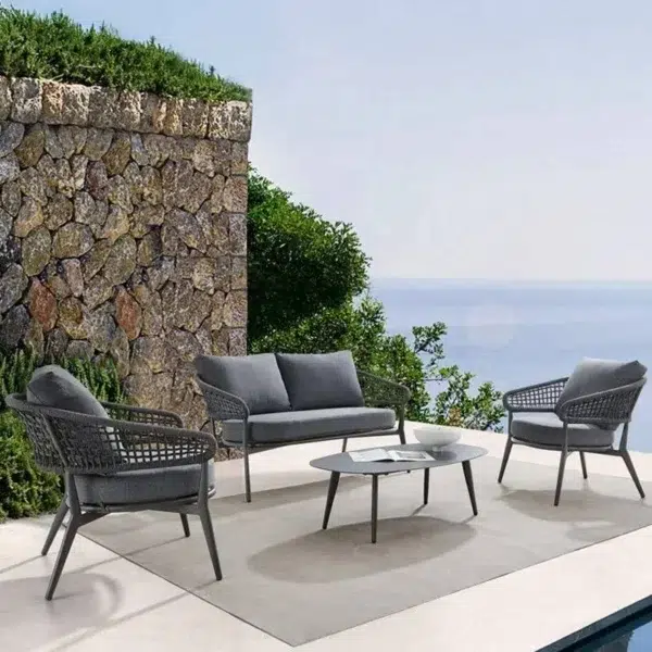Outdoor grey rope 4-seater bistro set with a table and chairs on a patio