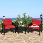 3-piece rattan wicker patio furniture set with dark brown frame and red cushions, including two chairs and a small table