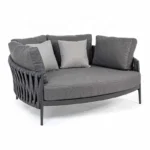 grey outdoor braided rope daybed on a patio with cushions