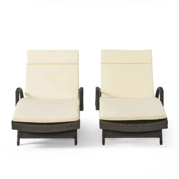 Dark brown rattan sun lounger set with cream cushions and adjustable backrests for patio, lawn, or beach.