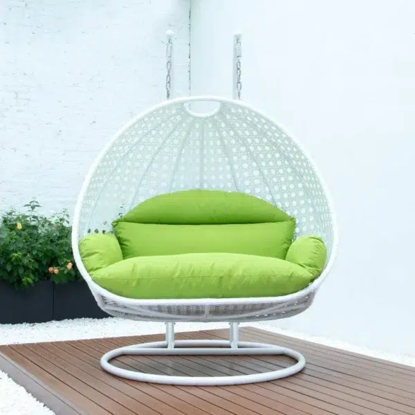 Light green and white swing chair with a sturdy stand and cushioned seat, perfect for indoor and outdoor relaxation.