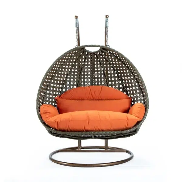 Stylish outdoor egg chair swing with cushion for garden, balcony, or patio relaxation.
