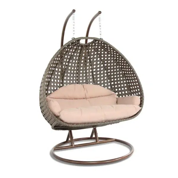 Double seater hanging swing chair with dark brown wicker frame and cream cushions