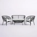 4-seater outdoor rope sofa set in black and white with a matching center table placed on a patio.