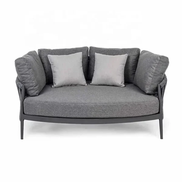grey outdoor braided rope daybed on a patio with cushions