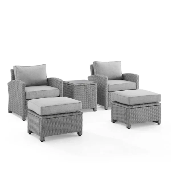 5-piece silver and grey patio furniture set with chairs, table, and cushions on a garden patio