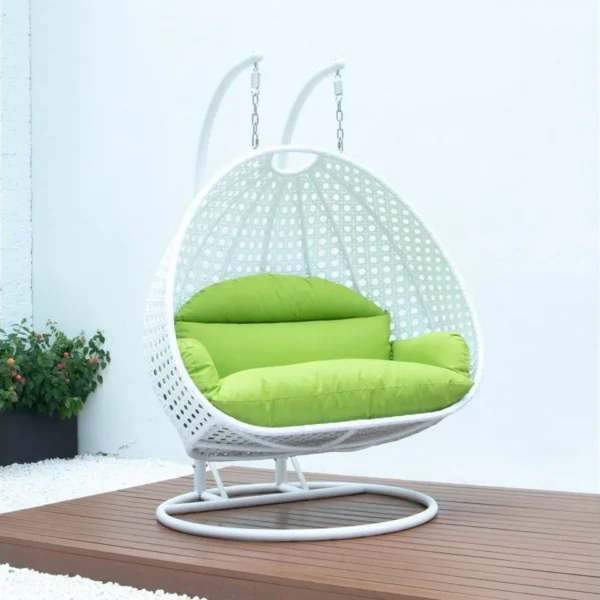 Light green and white swing chair with a sturdy stand and cushioned seat, perfect for indoor and outdoor relaxation.