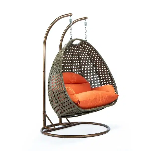 Stylish outdoor egg chair swing with cushion for garden, balcony, or patio relaxation.