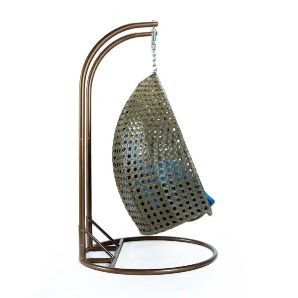 Double seater hanging swing chair with dark brown wicker frame and cream cushions