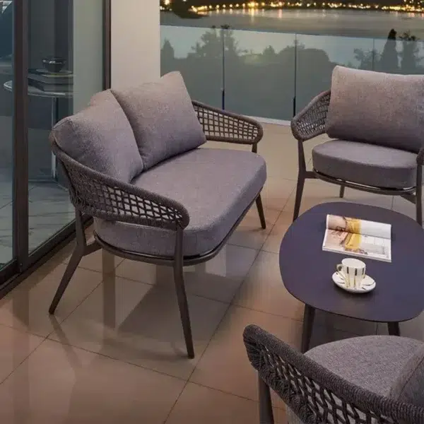 Outdoor grey rope 4-seater bistro set with a table and chairs on a patio