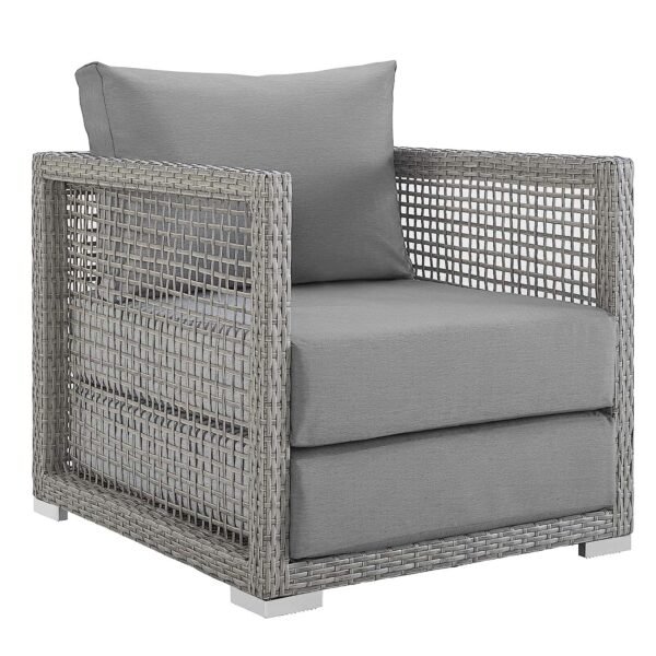 Outdoor 6-piece rattan wicker sectional sofa set in silver and grey, placed in a garden setting with cushions.
